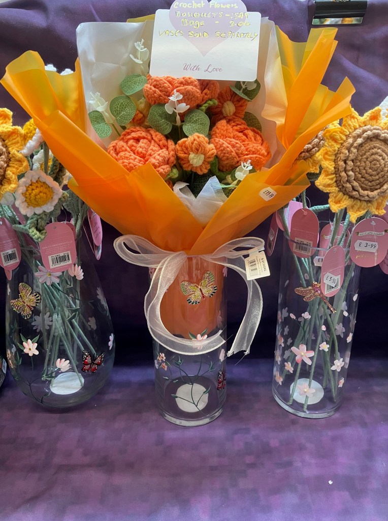Crocheted flowers in vases