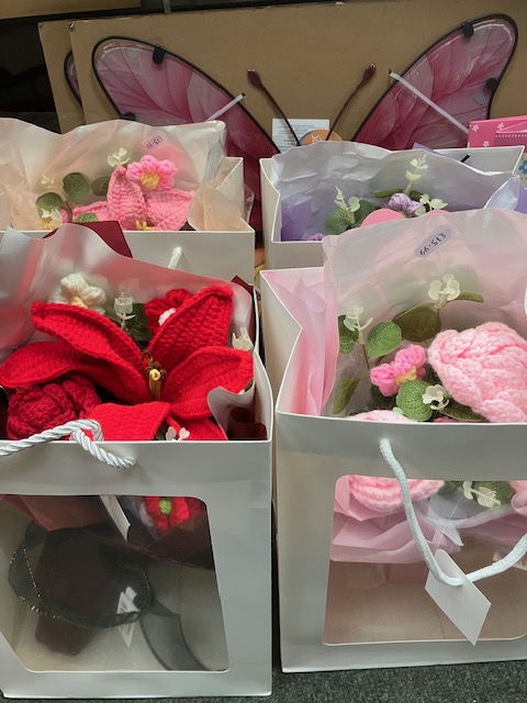Crochet flowers in gift bags