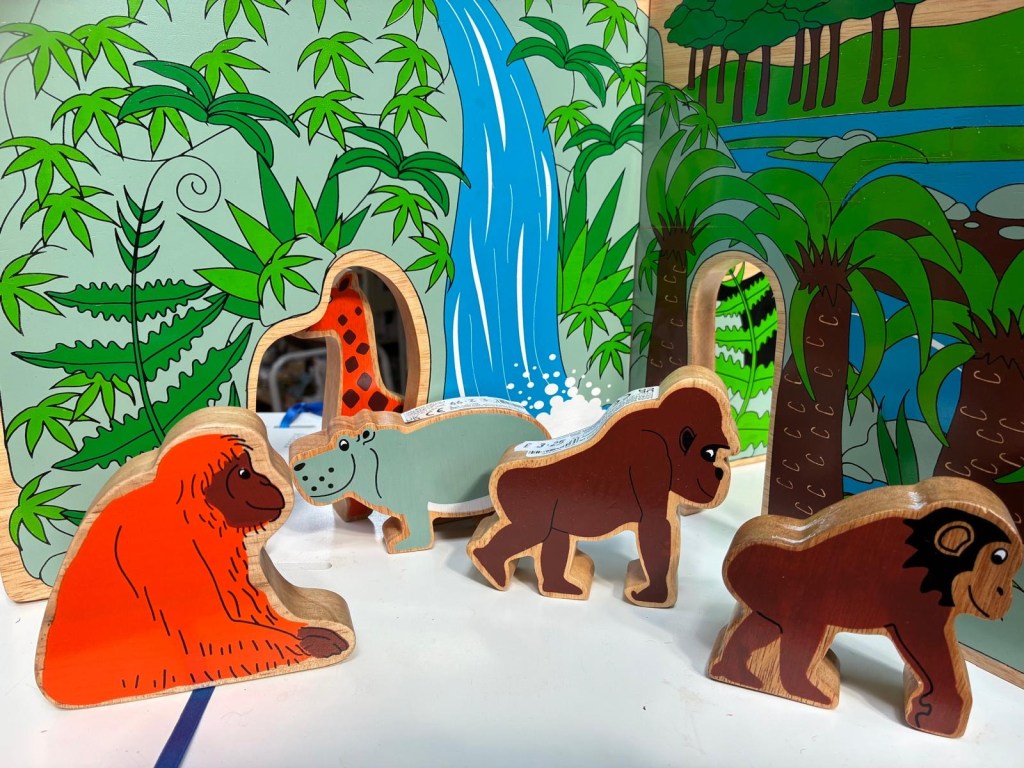 Wooden orangutan, chimpanzee and hippo figure