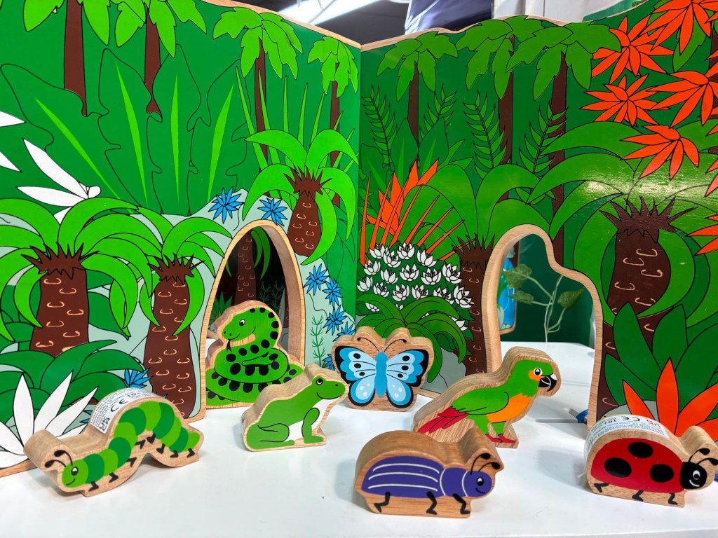 Wooden animals including bugs, frog and snake