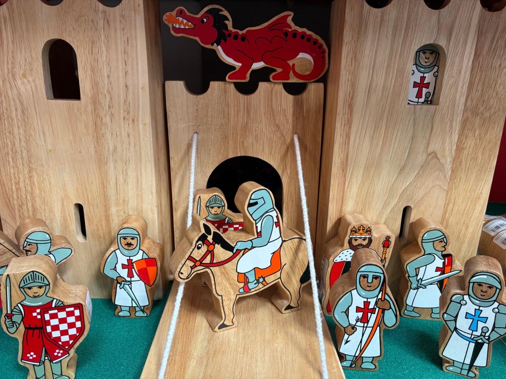 Wooden castle with knights and dragon